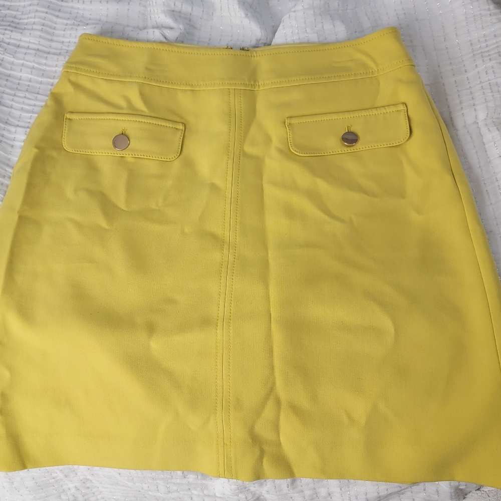 bright yellow skirt with front pockets